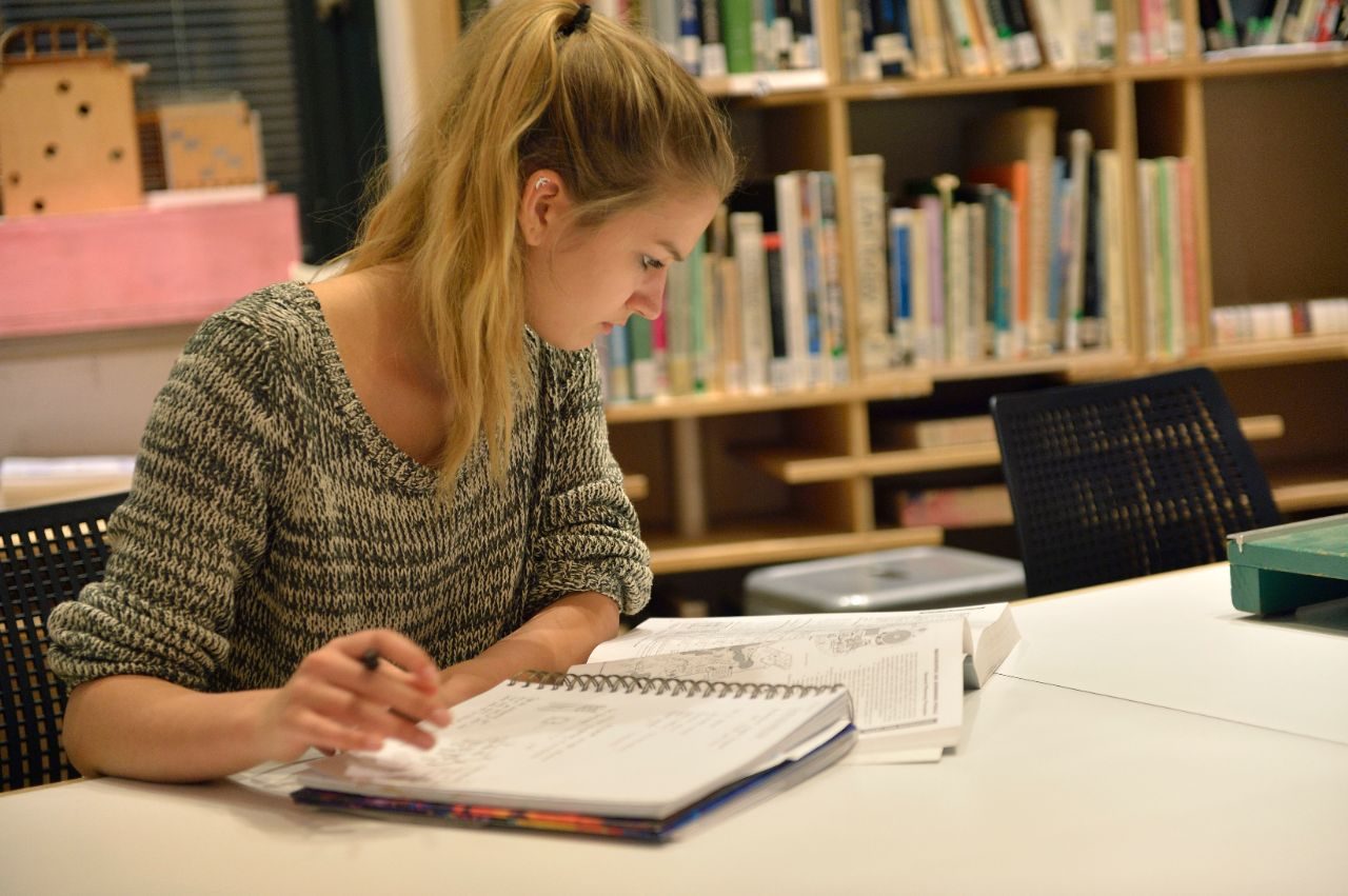 Student studying at a table.