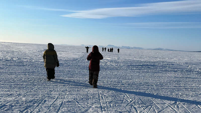    Group in Alaska walking on ice over the Kotzebue Sound.  Photo by Andi Ogier.