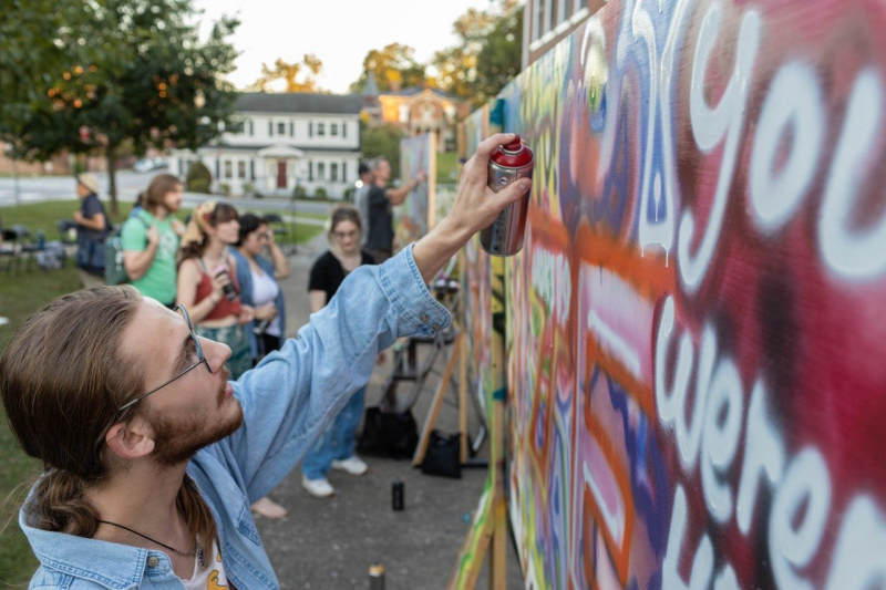 Tanner Valachovic participates in the aerosol art workshop. Photo by Kaleigh Miller for Virginia Tech.