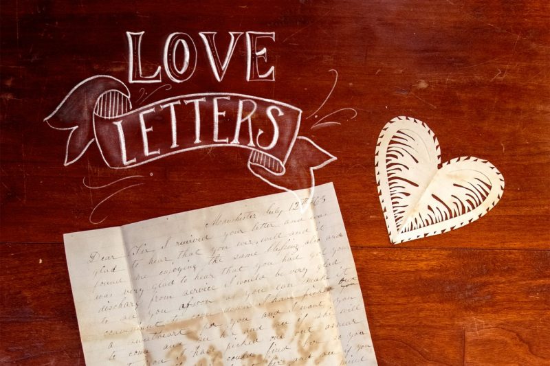 "Love Letters," an aged letter and paper heart.