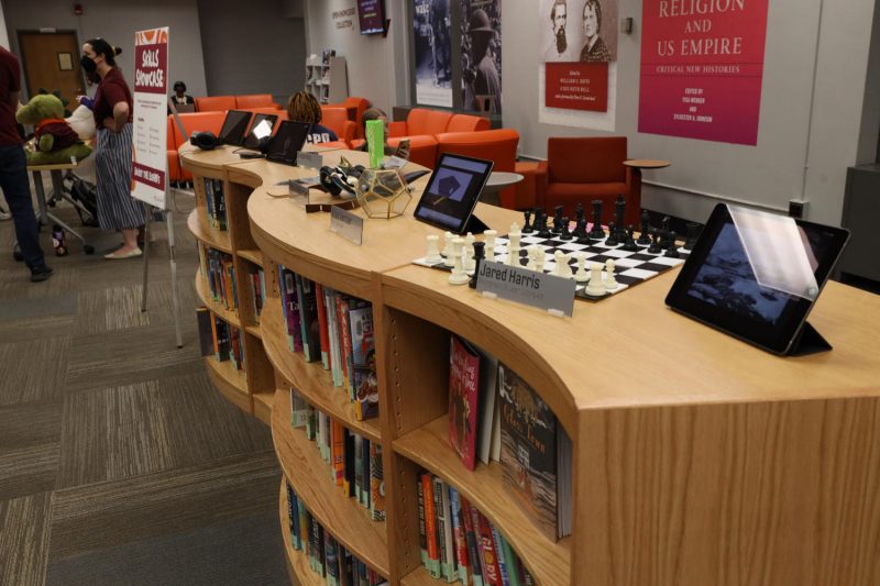 The skills showcase event with patron-made items on a bookshelf