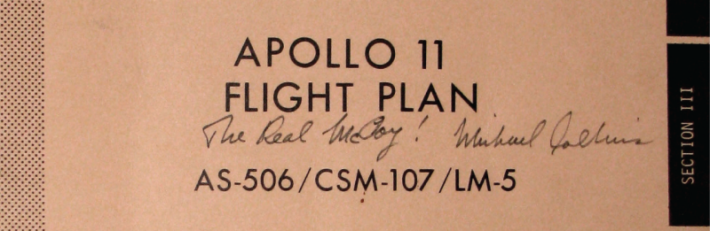 A photo of the Apollo 11 flight plan, with handwriting across the center that reads, "The Real McCoy! Michael Collins"